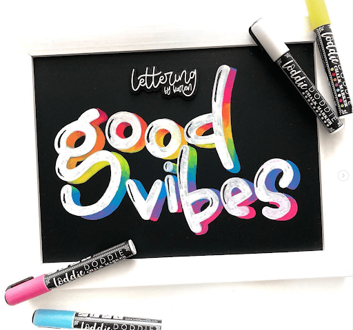 A decorative chalkboard with chalk markers.